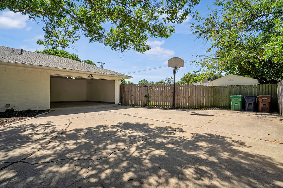 View of OVERSIZED driveway plus 2 car garage