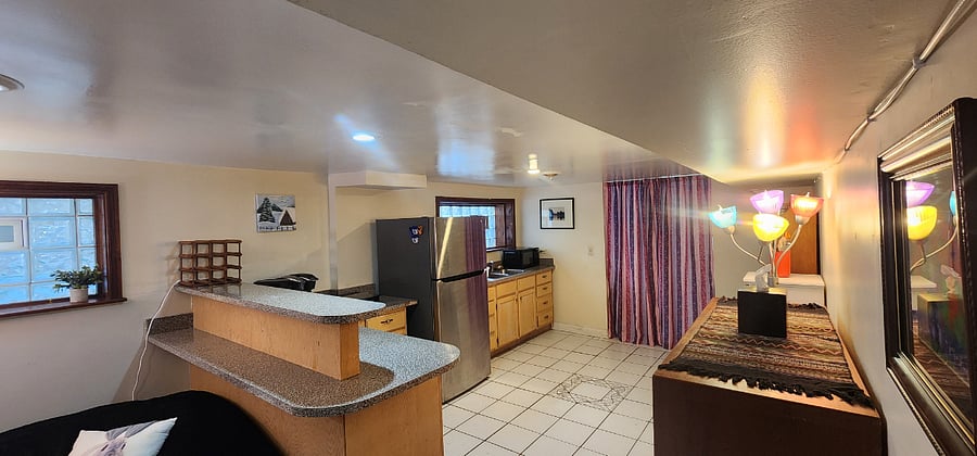Open living room and kitchenette area makes it easy to entertain