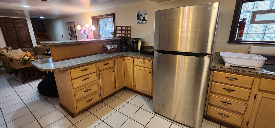Full-sized refrigerator with ice maker in the freezer and Brita water pitcher in the fridgeCoffee