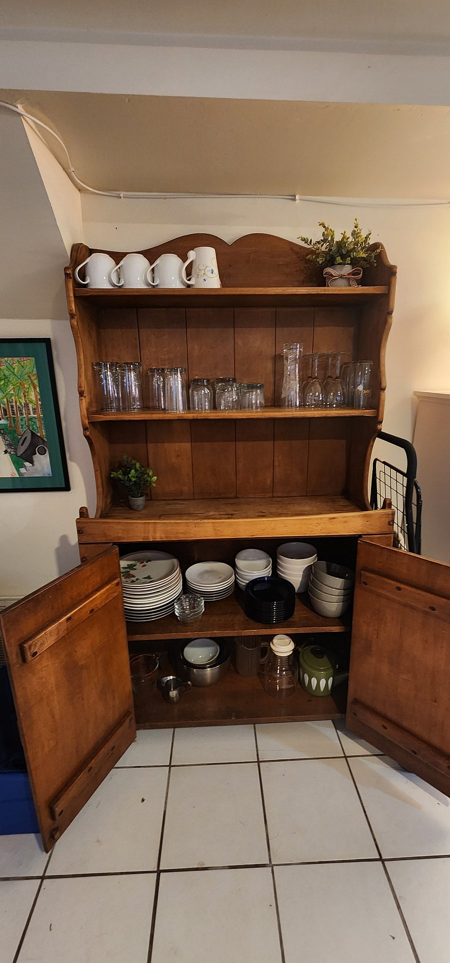 Plenty of plateware, glasses, cups and mugs, and other cookware