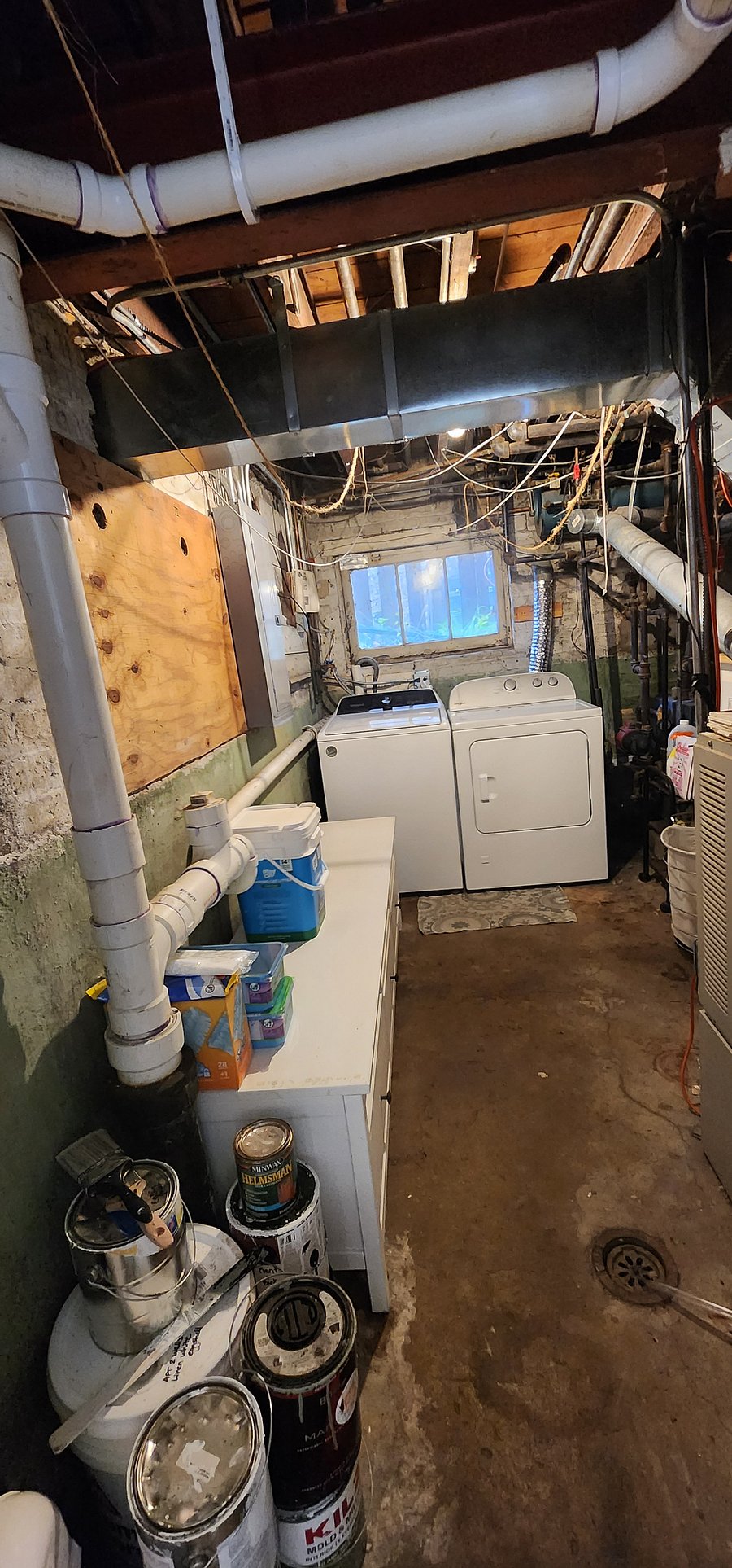 Shared laundry room (on other side of curtain, at bottom of staircase) is available for use with a washer, dryer and hanging lines