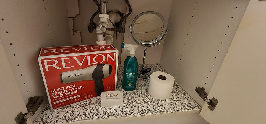 Hair dryer, magnifier mirror, shampoo, conditioner and soap are included