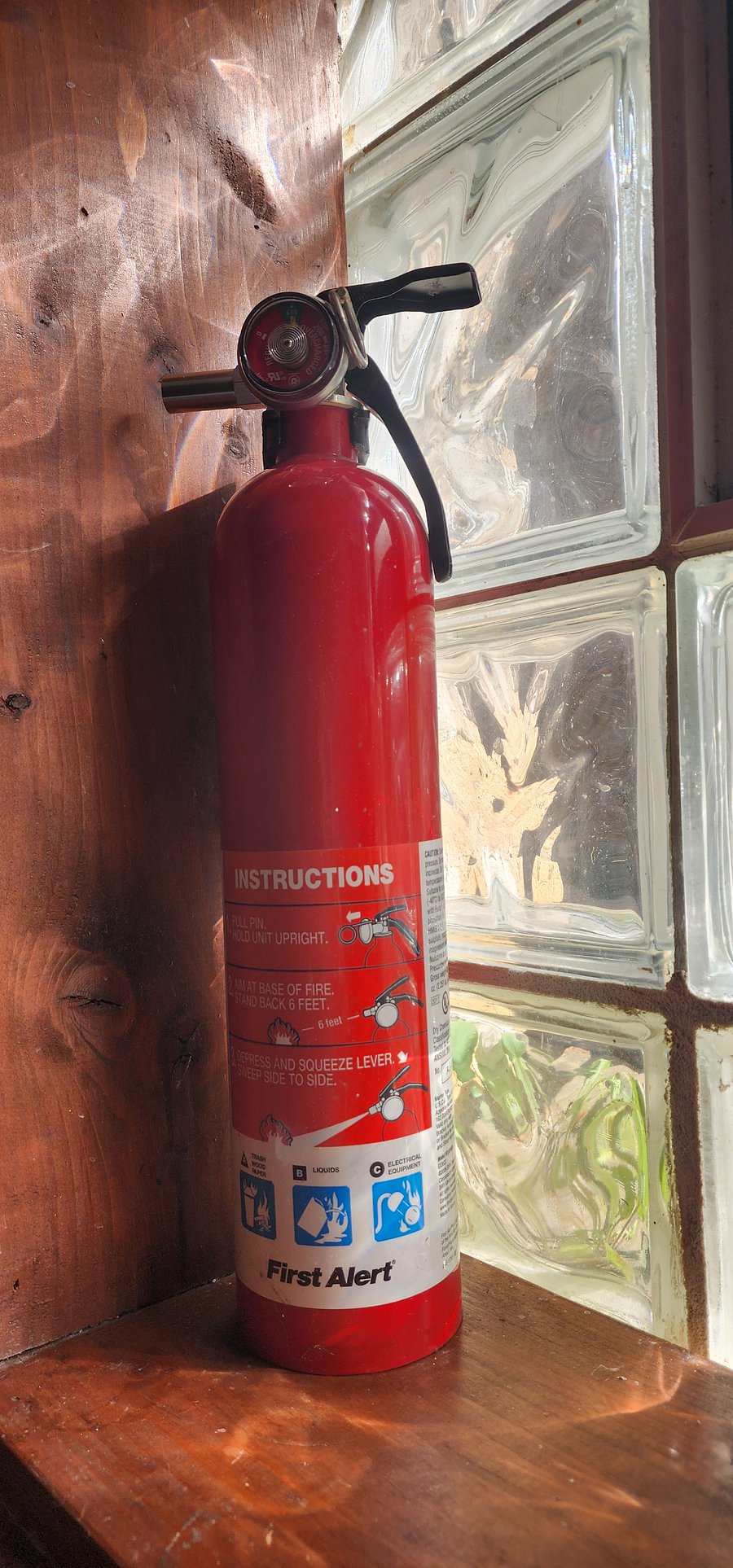 Fire extinguisher in kitchenette for safety