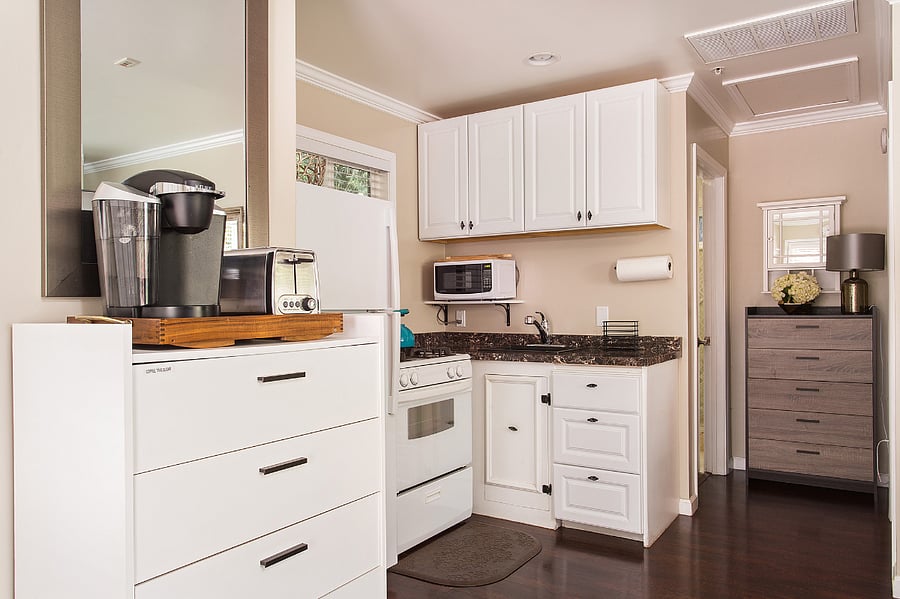 Kitchenette with full size refrigerator, stove top and oven combo, microwave, Tea/Coffee station