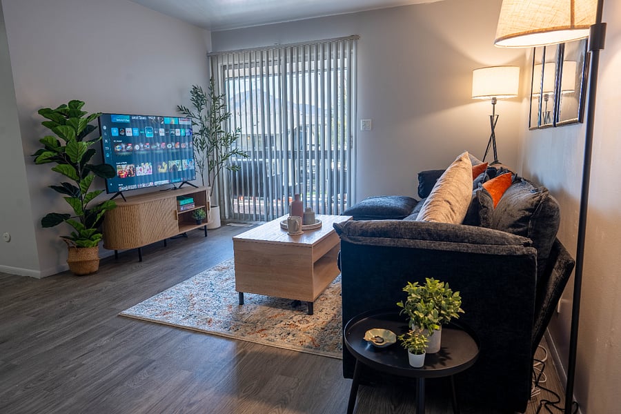 Living room with spacious sectional and 55" Smart TV.