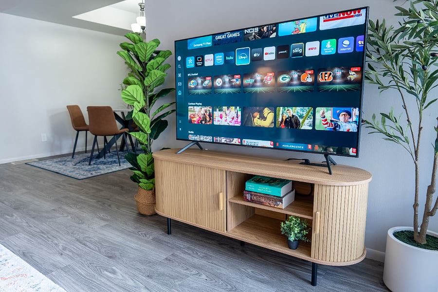 55" Smart TV with spacious storage console.