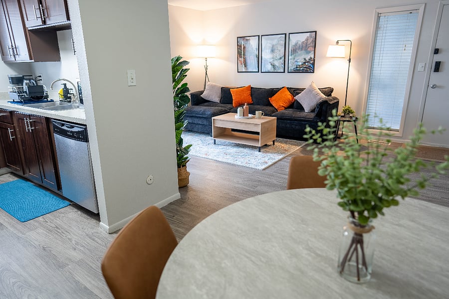 Dining room set with natural flow into living room.