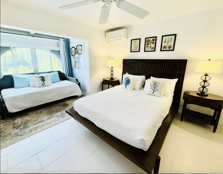 Downstairs garden room with queen bed, trundle, tv and en suite fully remodel bathroom with walk in shower. Smart TV in this room. All bedrooms have blackout curtains.  