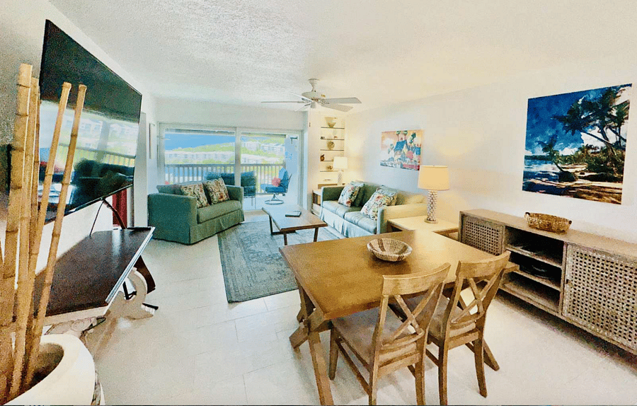 Family room with breakfast nook and kitchen bar.  Giant smart TV for all your lounging needs.  