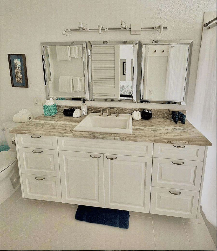 Primary king suite bathroom with walk in shower overlooking the bay.  