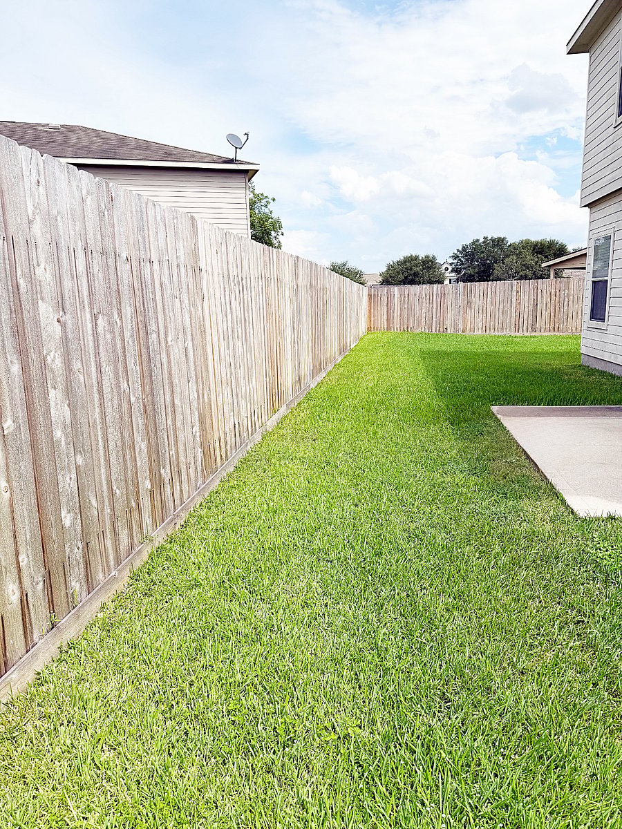 Large fenced in U shape Backyard with a grill