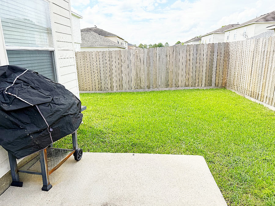 Large fenced in U shape Backyard with a grill