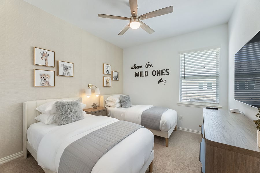 Comfortable third bedroom perfect for younger guests. Equipped with a 55" Smart TV, two twin beds with plush pillows, 400 thread-count sheets and memory foam mattresses, as well as a large walk-in closet.