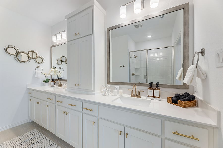 Luxurious Master bath with lots of storage and dual vanities. Cleaning supplies, a hairdryer and lighted vanity mirror provided, along with expanded essentials: cotton pads, Q-tips, Kleenex tissue, shower caps and makeup removing pads.
