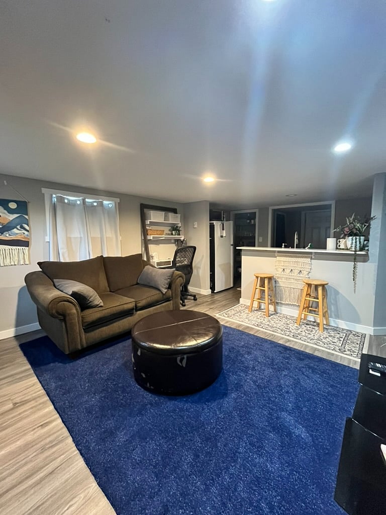 Open living room with smart tv and desk