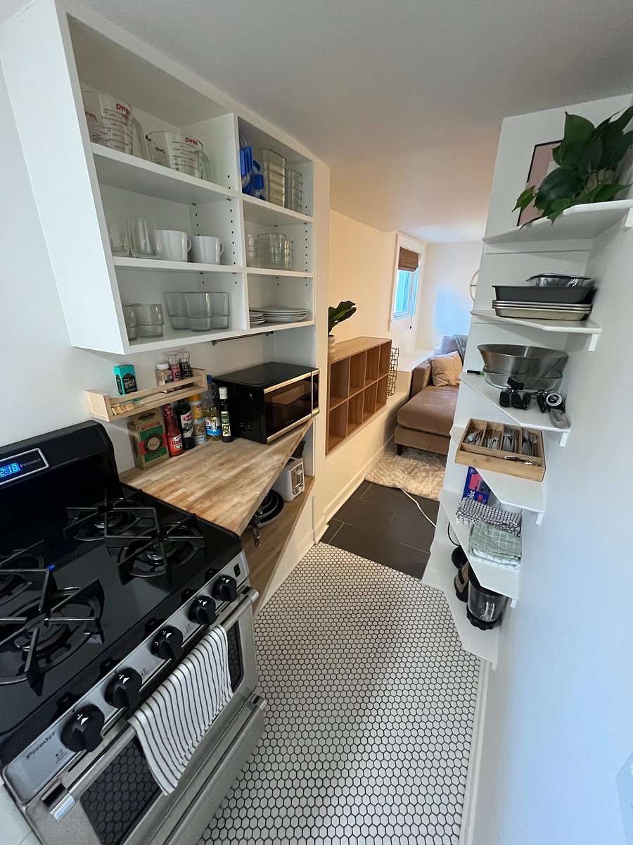 Stocked w/ plates, utensils, cookware