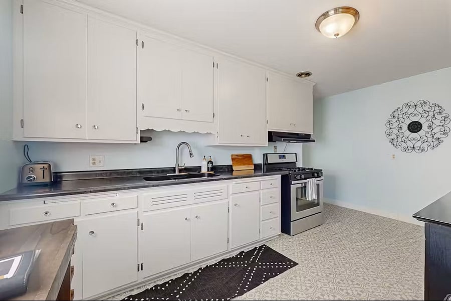 Kitchen with gas stove, Nutribullet, toaster, coffee-maker, and more!