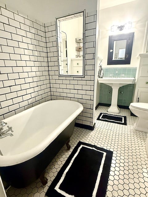 Bathroom #1 ~ the original 1928  bathroom in the home. recently renovated with new tile and paint. 
