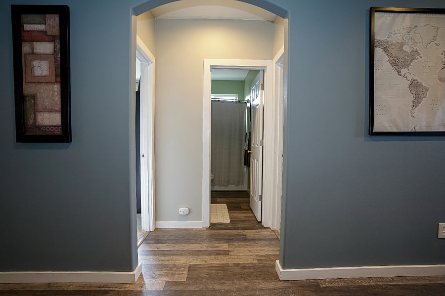 from hallway looking at guest bathroom. The 2nd bedroom is to the right and the office is to the left