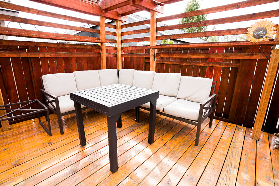 The outdoor table slides open to become a rectangle if needed for dinner