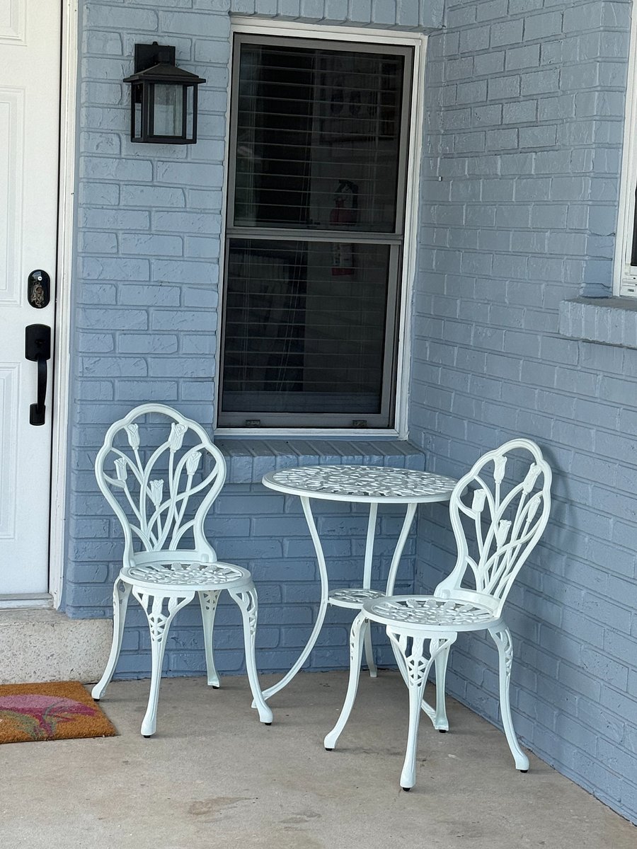 small seating under carport in front great place for morning coffee