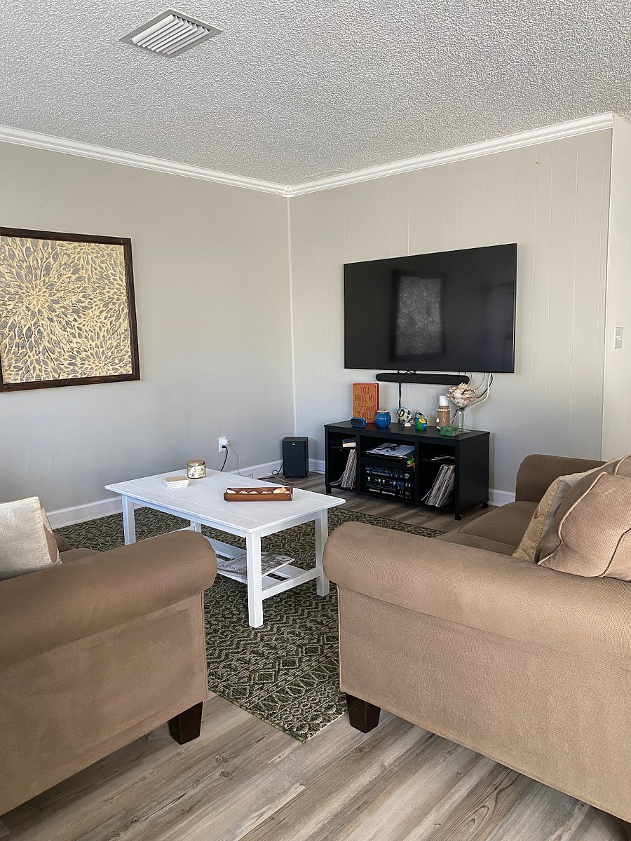 living room with 75" smart tv