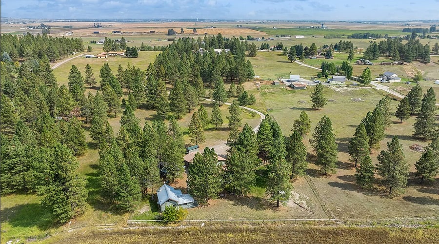 Aerial view of cabin and neighborhood. Cabin tucked back from main road by 0.5 mile driveway.