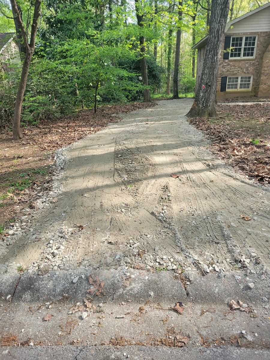 Guest's private gravel driveway leading to the gate next to the private entrance from rear of home.