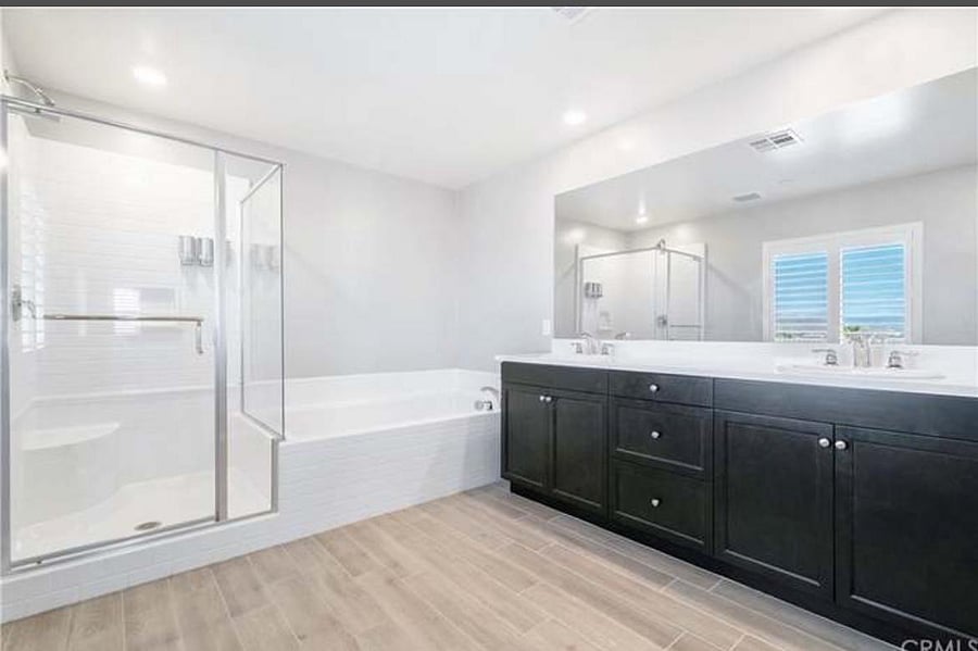 Master bedroom bathroom with walk in shower, bath and toilet