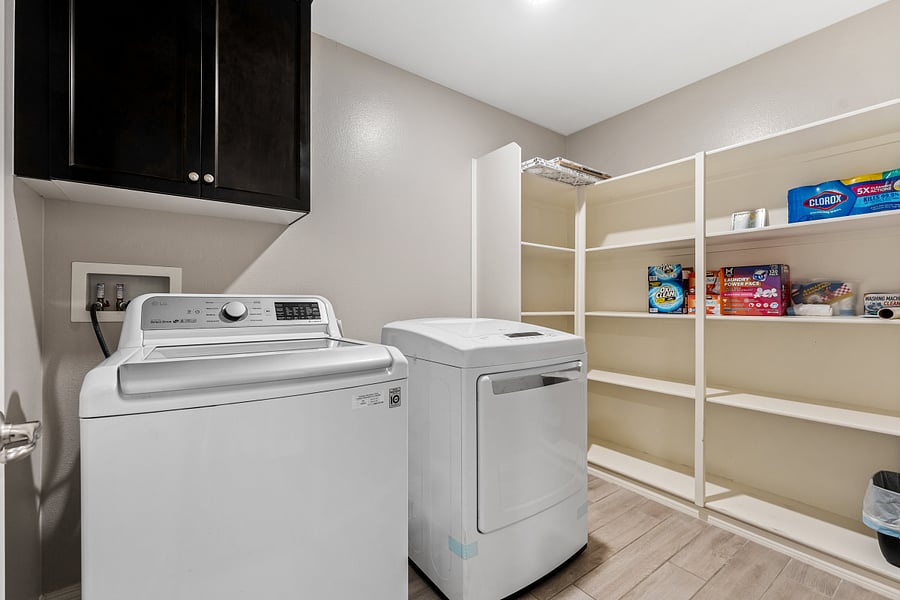 Laundry room with washer and dryer, cleaning products, clothes detergents and toilet papers etc, move in ready!