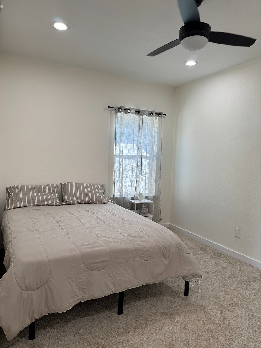 Second Bedroom upstairs also includes a night stand and a walk-in closet equipped with laundry hamper, velvet hangers.
