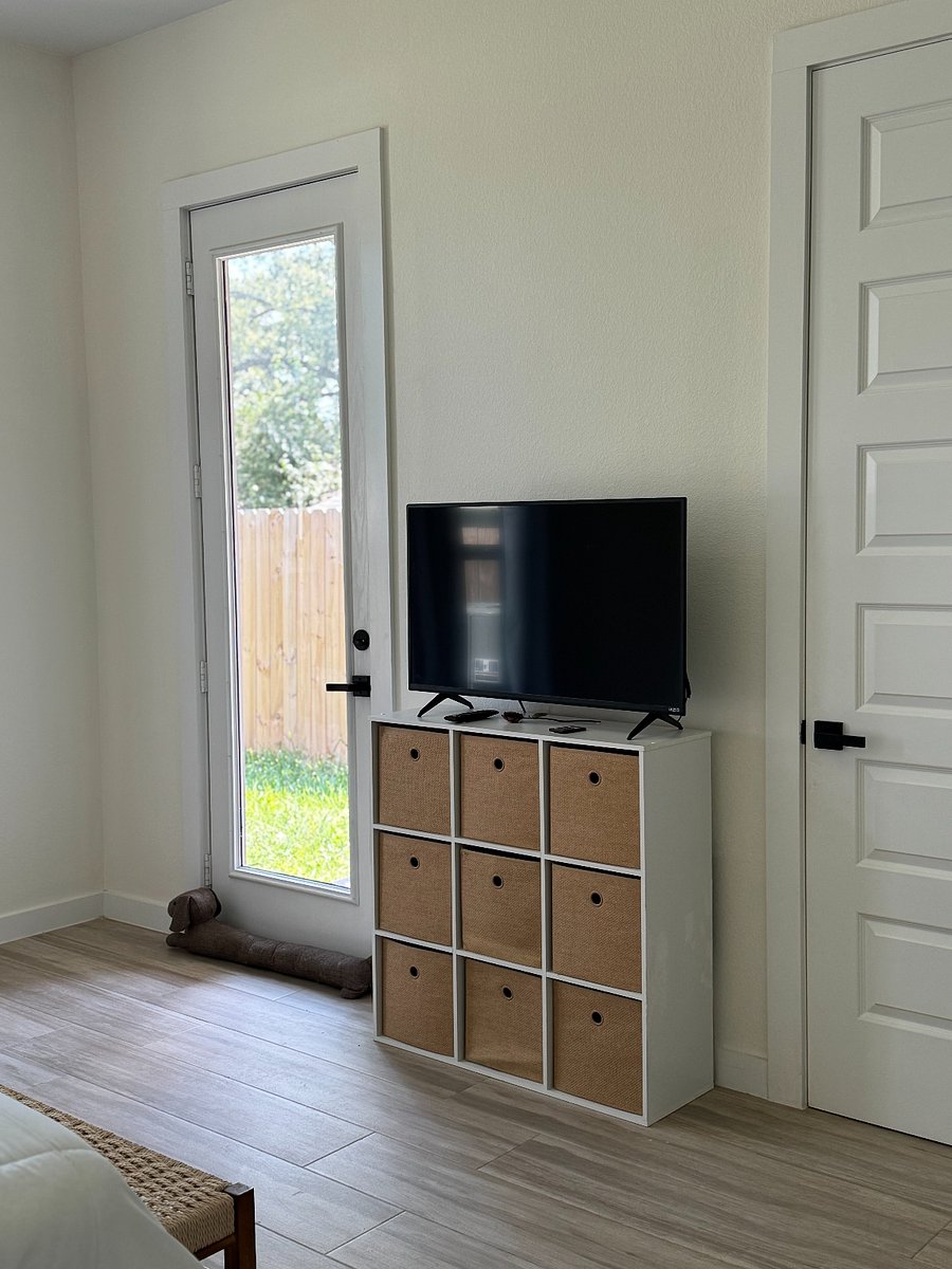 Master bedroom suite comes with its own smart TV, bathrrom and exit to the back yard.