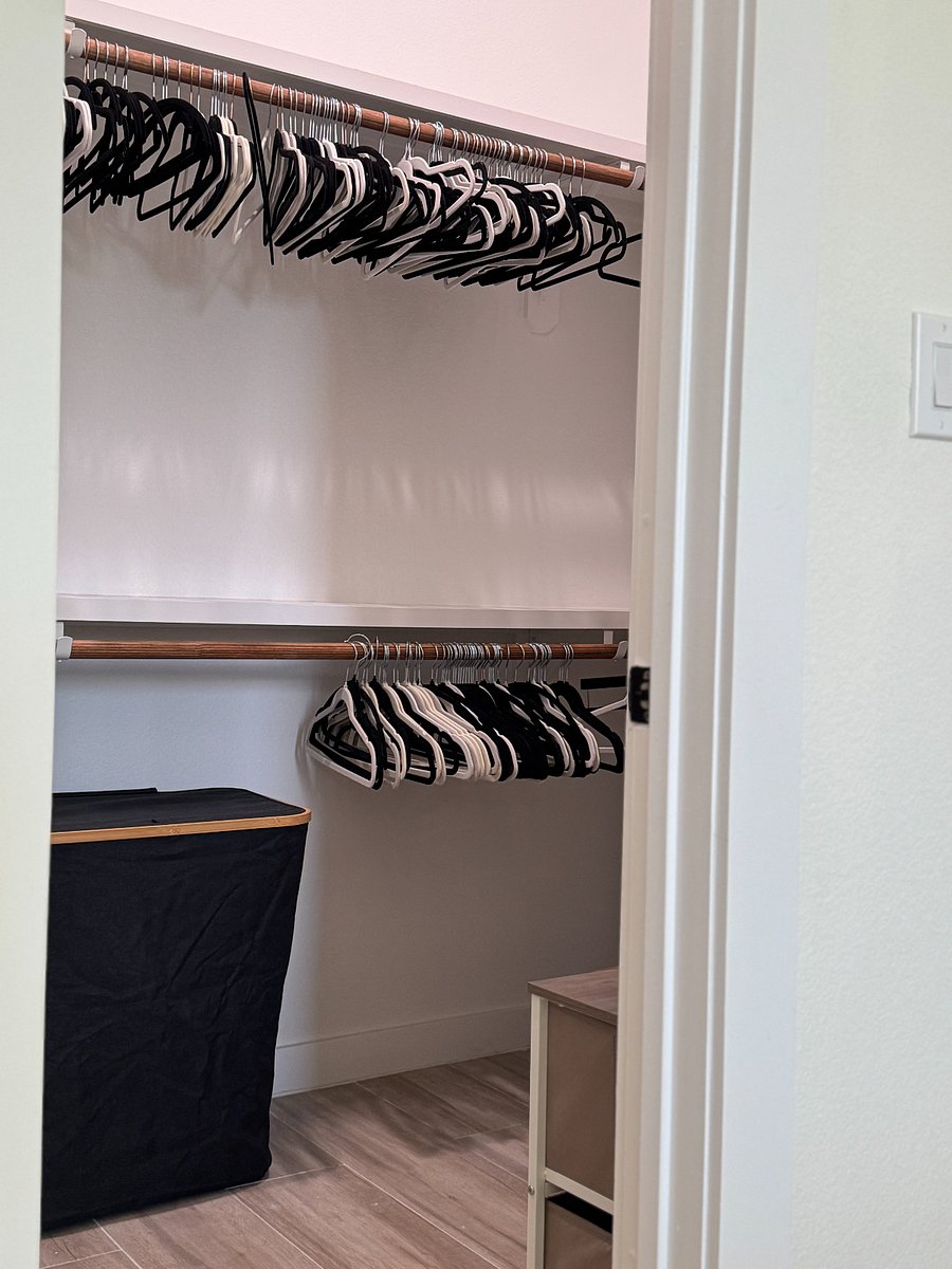 Master bedroom has a walk-in closet. Laundry hamper, velvet hangers and shoe rack included.