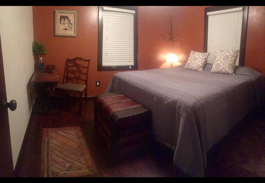 The larger bedroom has a king size bed.