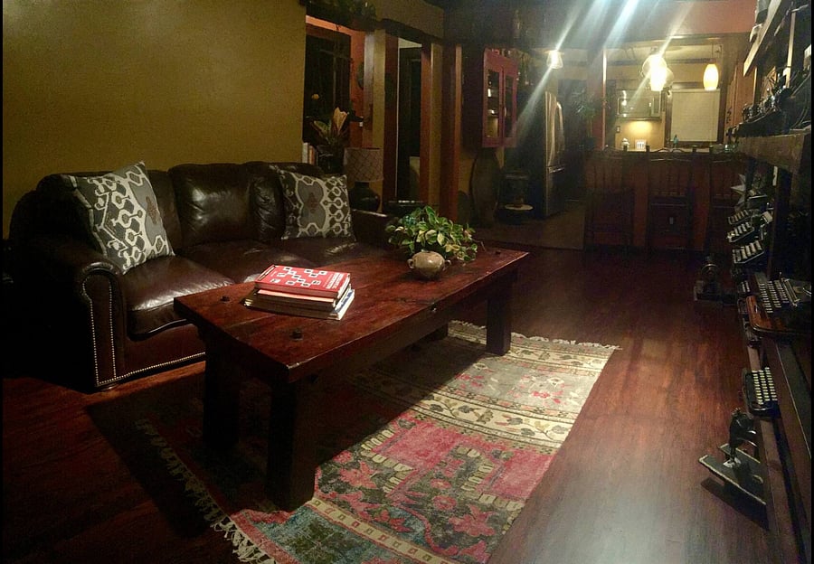 This is the living room. The door seen here is the entrance to the house.