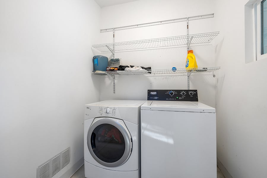 The HE washer and dryer, only shared with the renters in the upstairs unit, is around the corner from your entrance in its own room off the back patio.