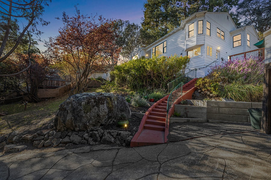 At dusk, lights on the stairs and along the driveway come on automatically for safety and security.
