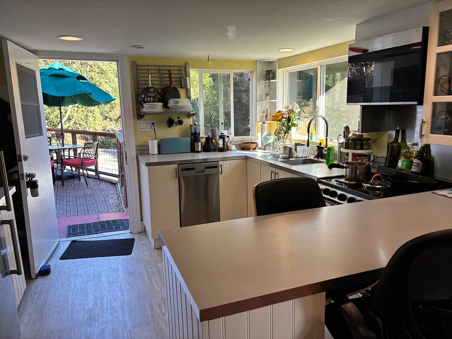 The countertop in the foreground can be used for work on the laptop or eating a meal.