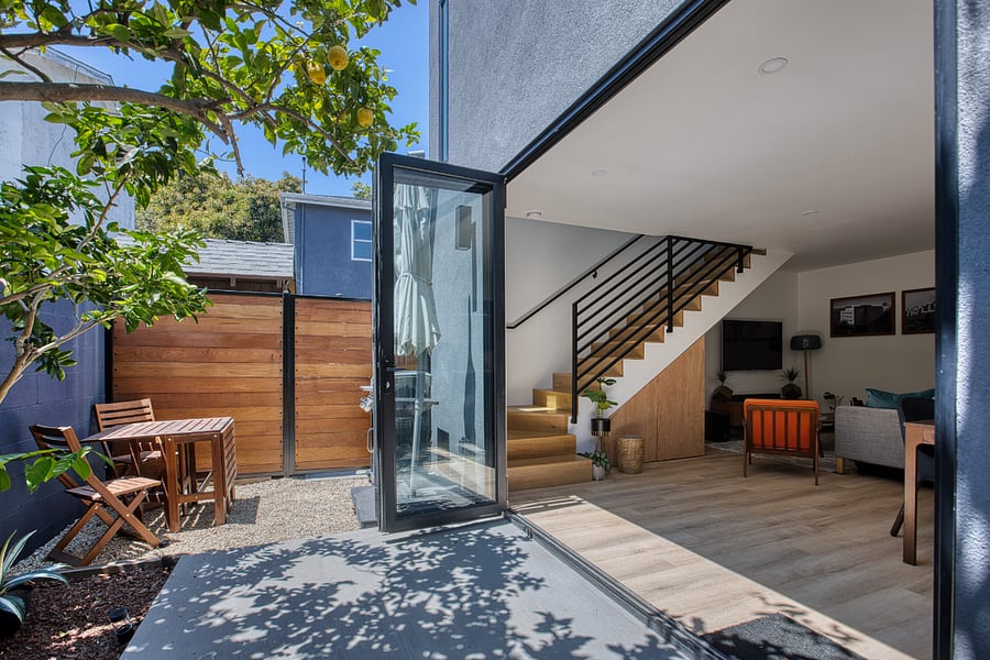 Large tri-fold doors leading to exterior patio space.