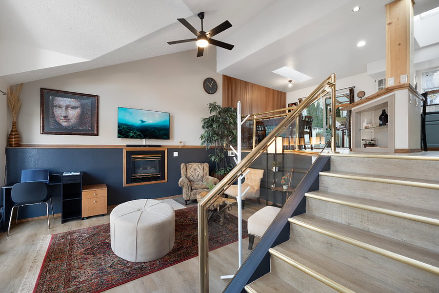 Upon entering the home, you step into the living room, which offers a clear view of the dining room and kitchen, creating an open layout perfect for easy conversations throughout the space.