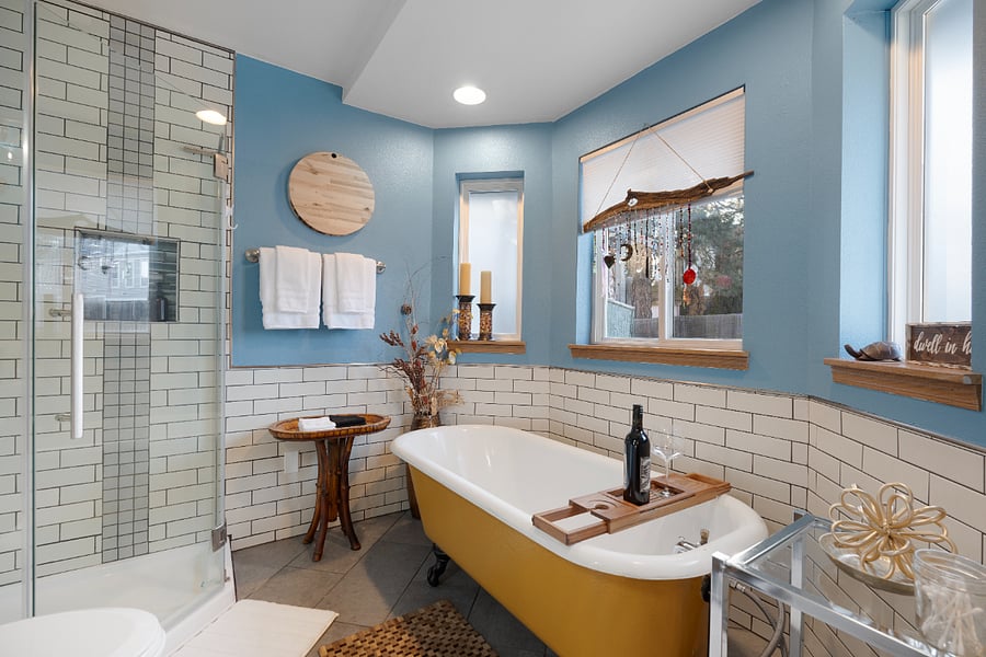 This one-of-a-kind master bath features a ceramic clawfoot tub, a shower with views of the backyard, and complimentary shampoo, conditioner, and body wash.