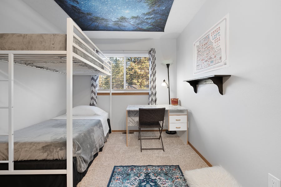 This fun room features two twin beds (bunk bed style), room-darkening curtains and blinds, a dedicated workspace, and plenty of clothing storage with closet space and hangers.