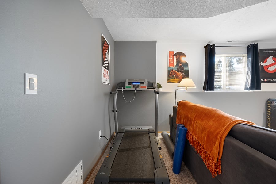 Looking to get some cardio in? You'll find the treadmill in the den, along with a couple of yoga mats and a rolling mat.