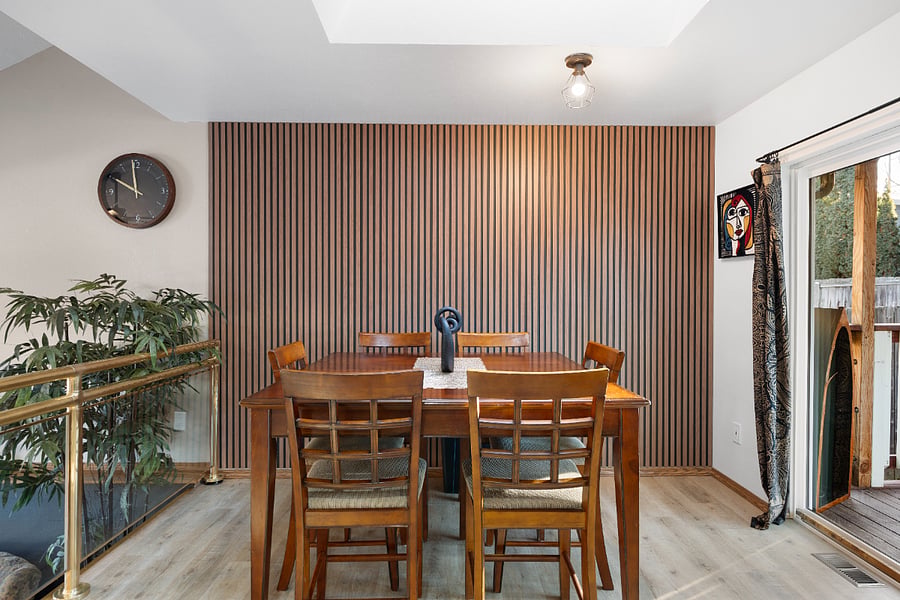 Continue the conversation effortlessly while enjoying the living room TV, the view of the backyard, and the open kitchen.