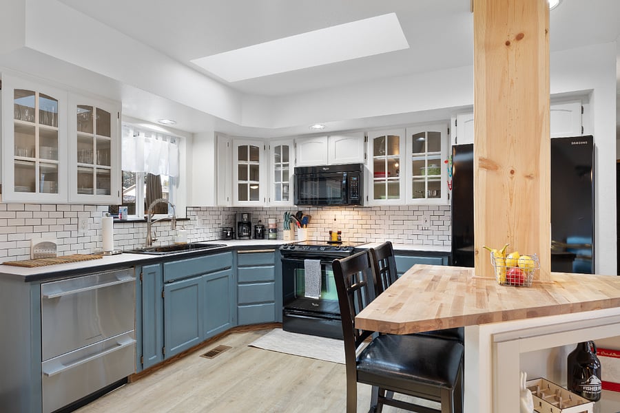 Below the baking and popcorn cabinet, you'll find a blender, coffee carafe, kettle, baking sheets, muffin pan, bread pan, cutting boards, crockpot, toaster, an 8.5-inch saut pan, 1-quart and 2-quart saucepans, and a 4-quart Dutch oven.