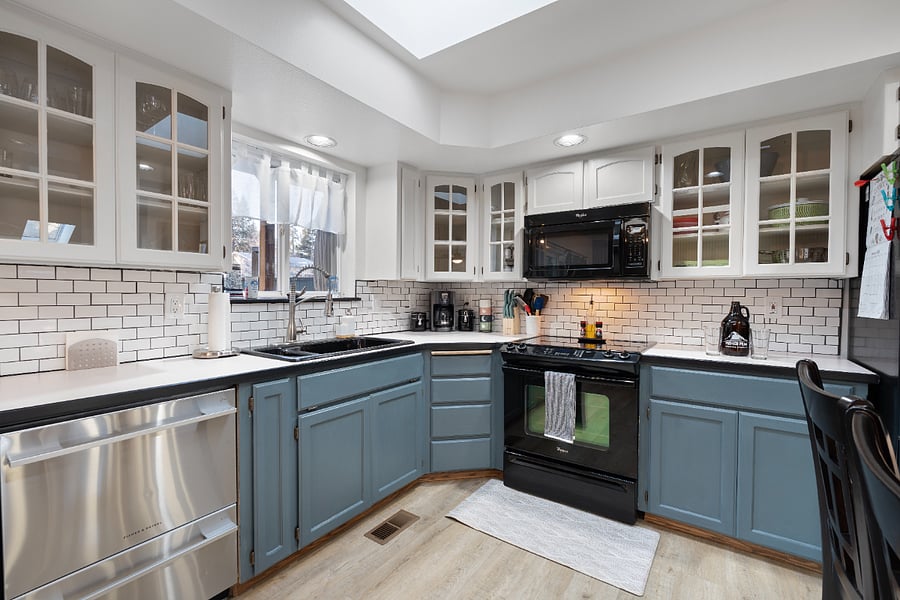 In the corner, you'll find a coffee maker with coffee and tea provided, along with spices, avocado oil, all your cutlery needs, kitchen utensils, storage bags, and a 4-piece kids' dining set.