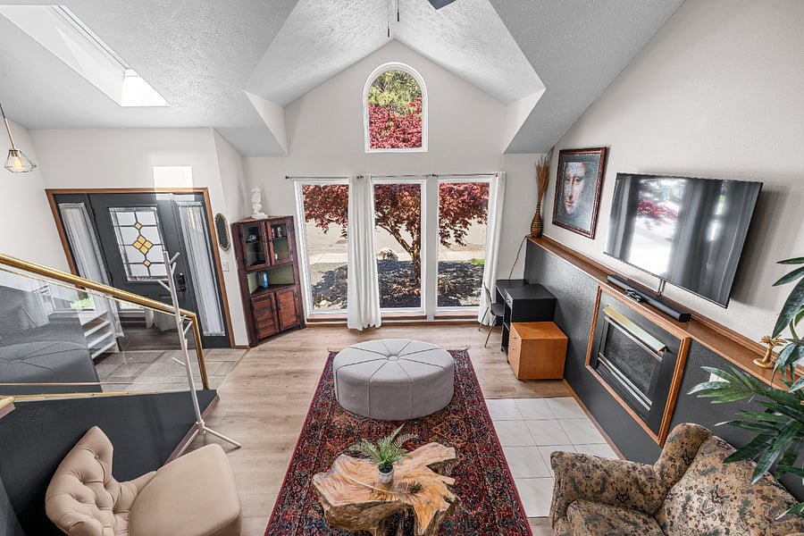 Bask in the natural light that fills the home while enjoying a dedicated workspace, a 55-inch smart TV, and a Bluetooth soundbar for your convenience and entertainment.