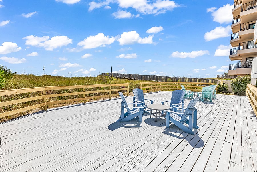 Expansive 1,100+ sq ft community deck with seating and tablesperfect for relaxing or gathering by the coast.
