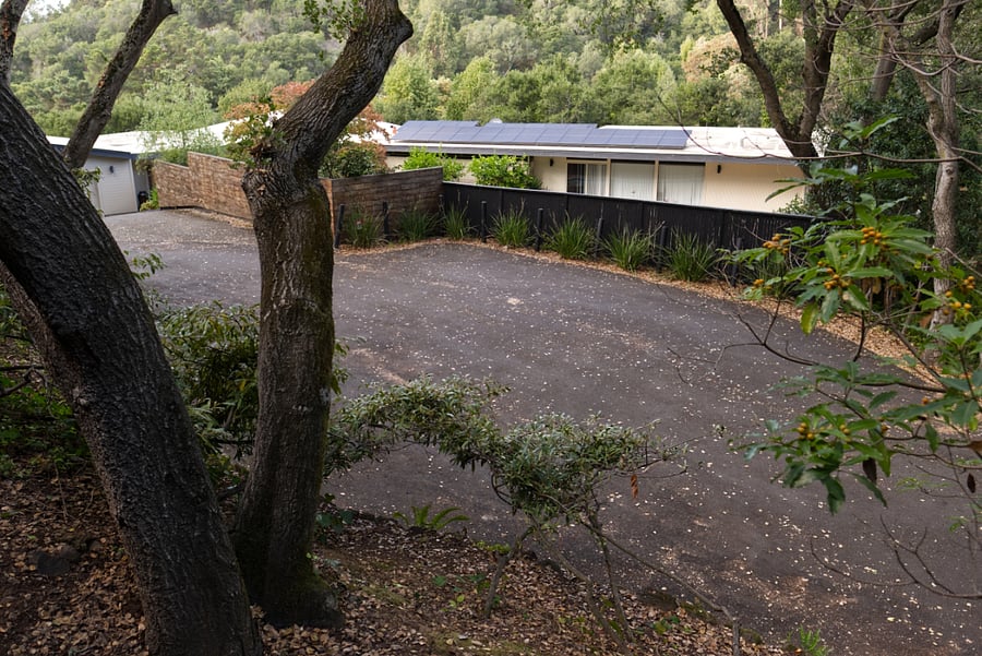 Private road parking below unit.