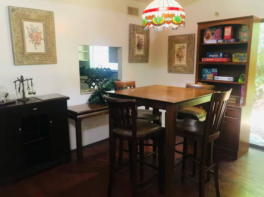The living room has a 4 person high top dining table adjacent to the kitchen. In addition there is a dining table for 4 on the private deck through the sliding glass doors.